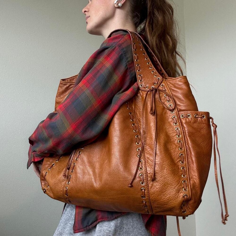 Kooba oversized soft leather hobo bag with braided grommet details